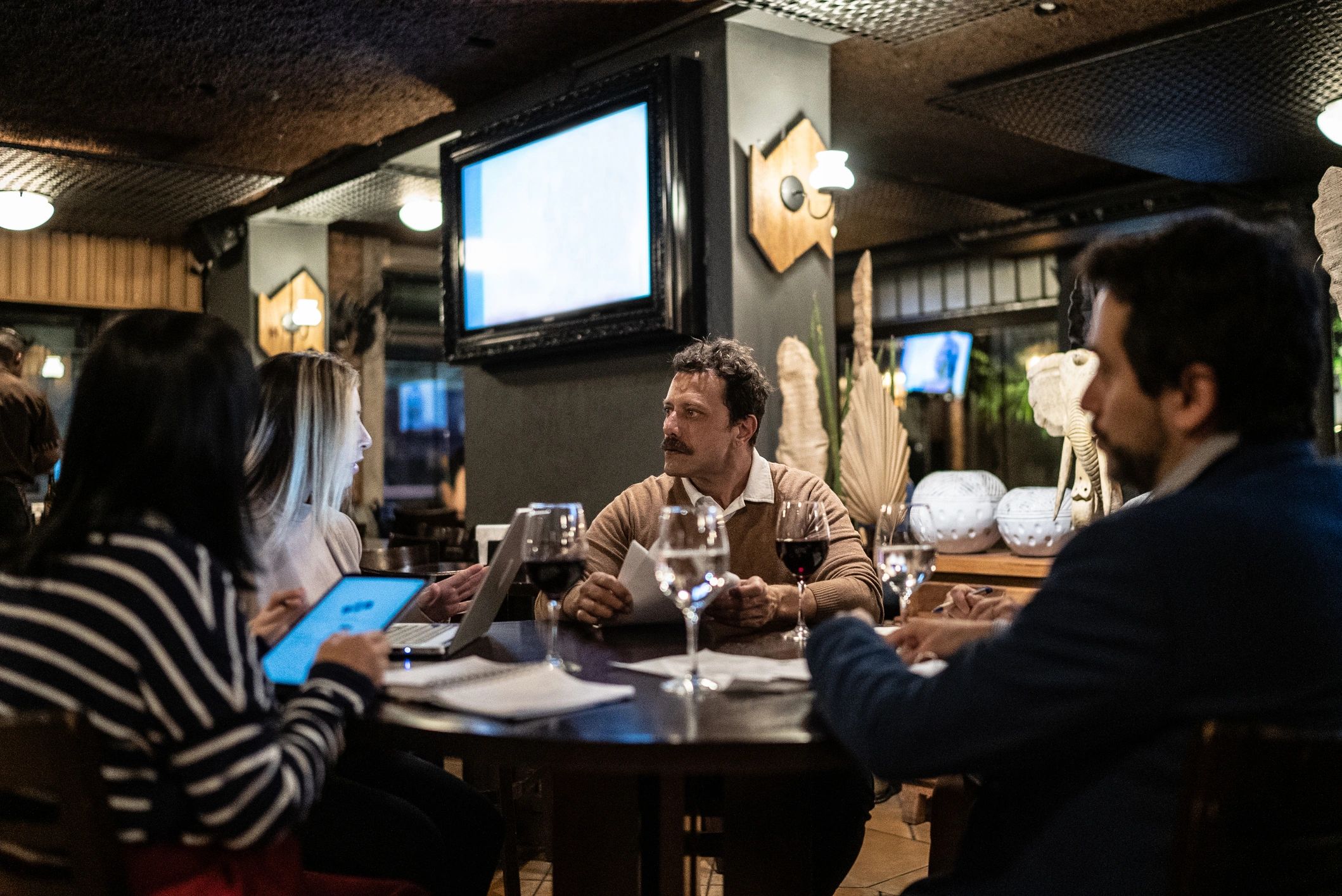 Coworkers meeting at a bar