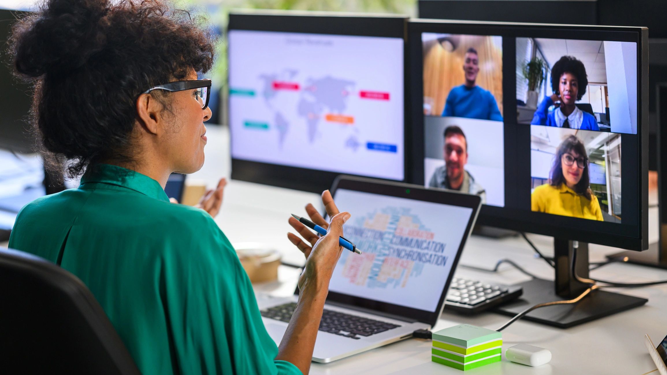 Business analyst reviewing performance data on a laptop during a strategy session