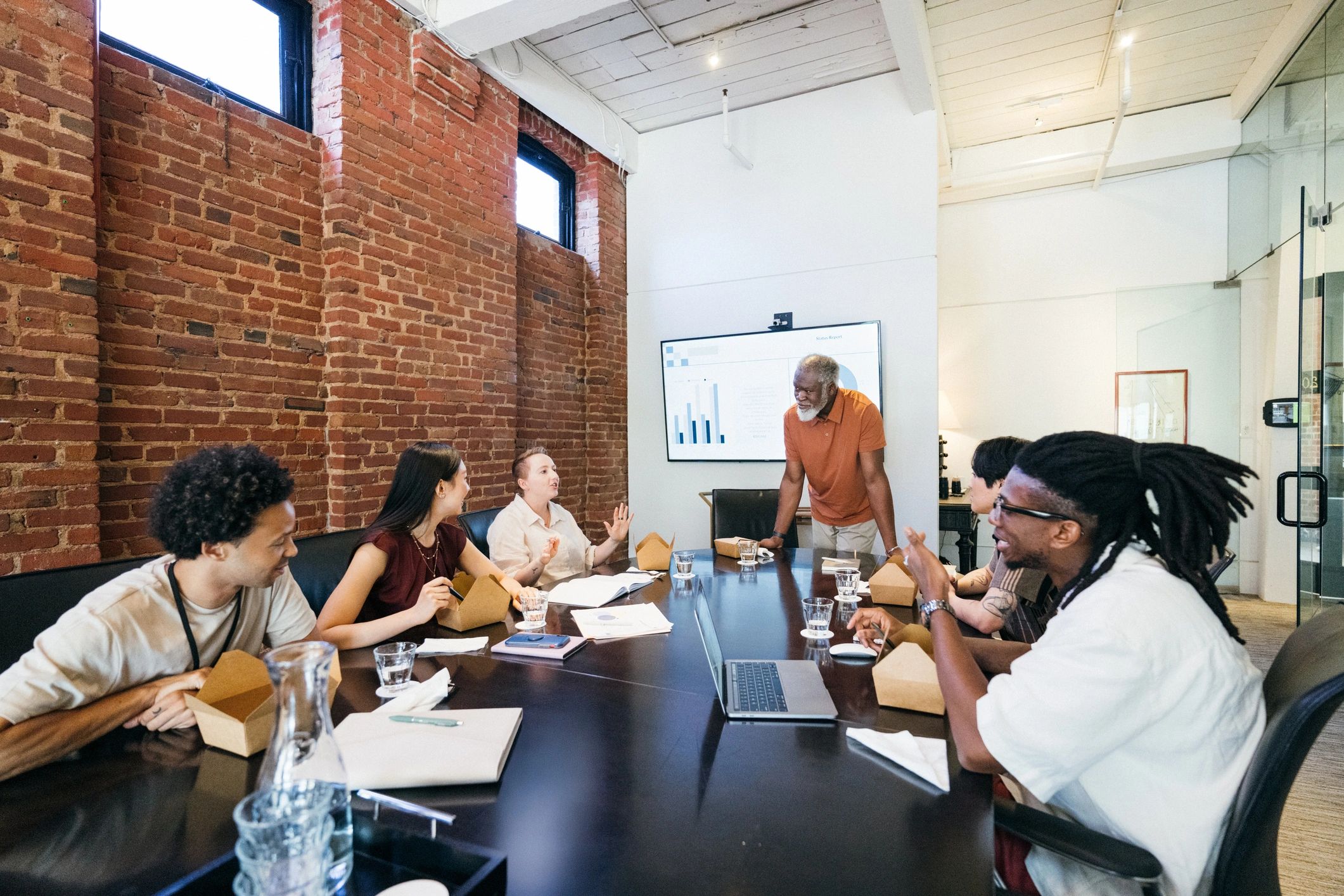 Restaurant operations team meeting in a boardroom